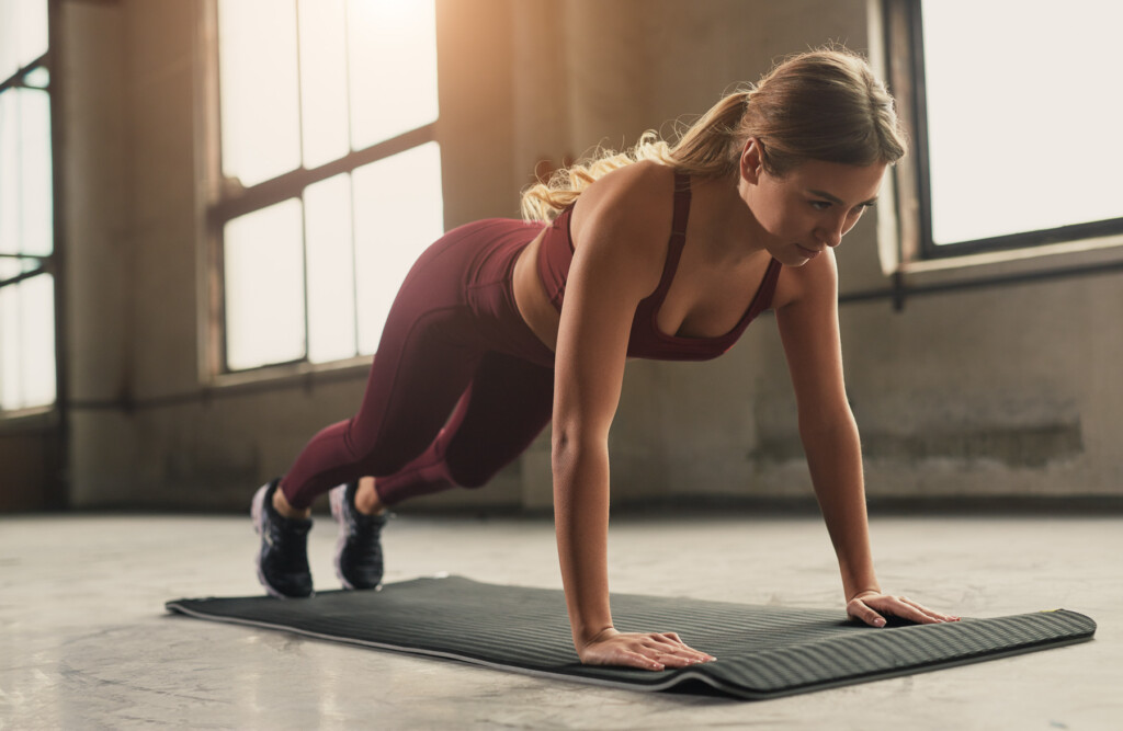 sporty-woman-doing-push-ups-exercise-2023-11-27-05-20-29-utc