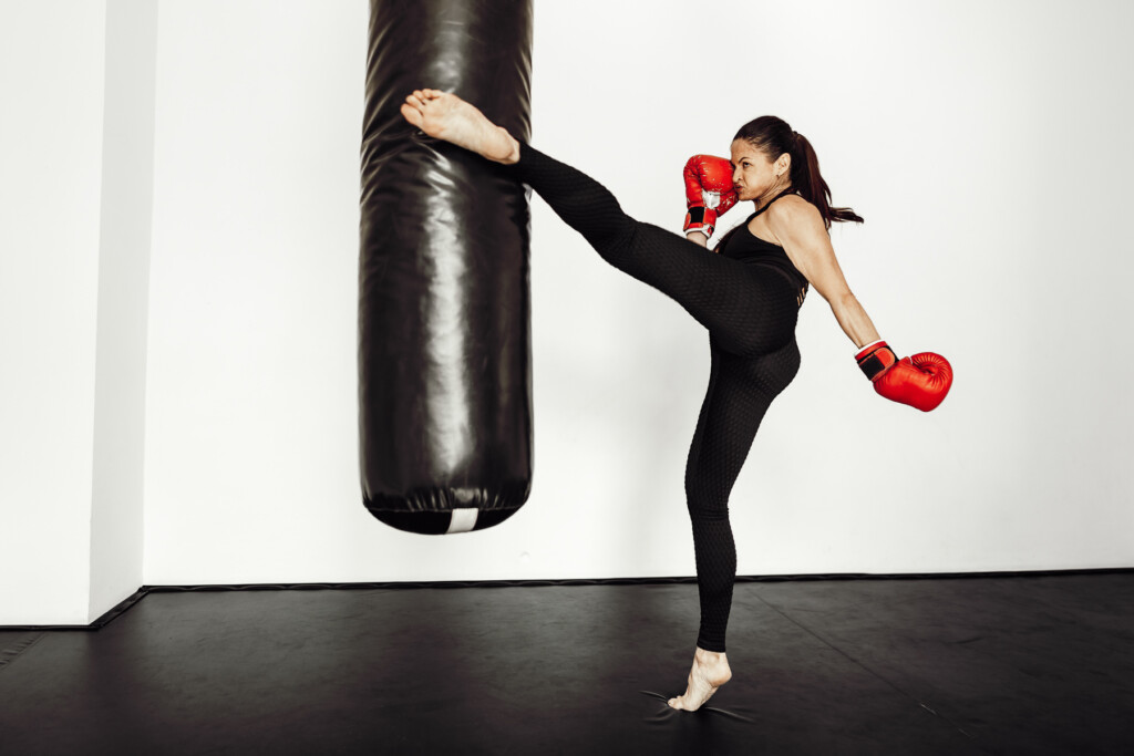 woman-athlete-in-red-boxing-gloves-hits-a-pear-in-2023-11-27-05-21-28-utc